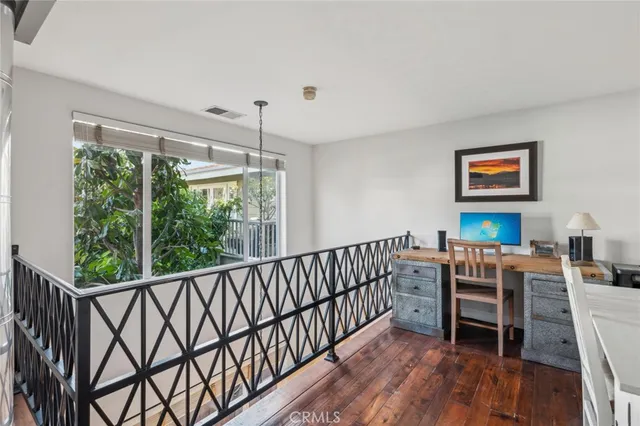a bathroom with a sink a mirror a vanity and shower