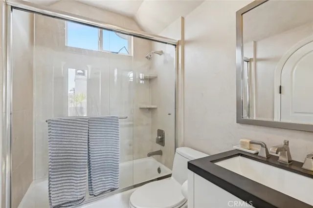 a view of a livingroom with furniture window and wooden floor