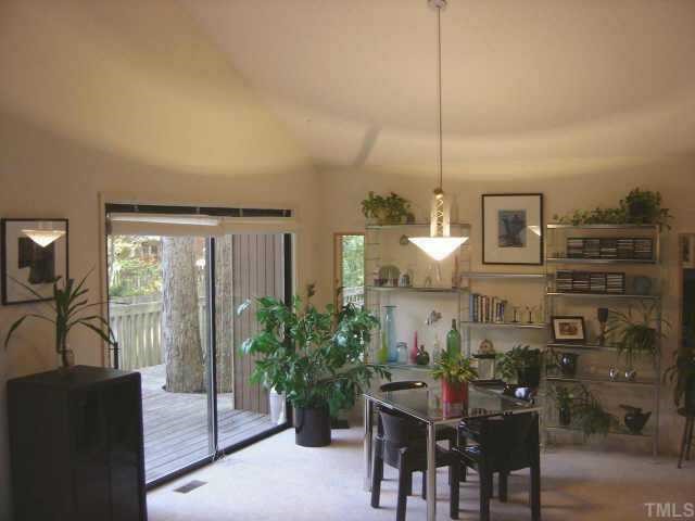 7405 Old Hundred Road Raleigh, NC 27613 - Photo 4 of 10 a view of a dining room with furniture window and outside view