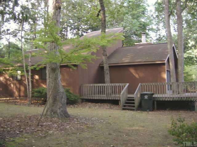 7405 Old Hundred Road Raleigh, NC 27613 - Photo 8 of 10 a view of backyard with deck and outdoor seating