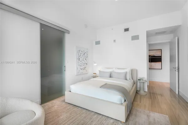 a bedroom with a bed and a couch