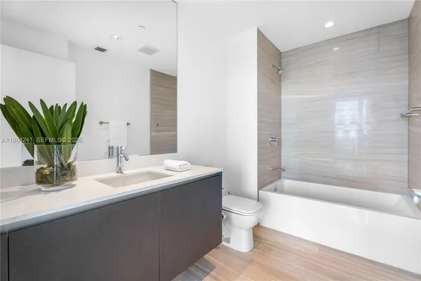 a bathroom with a bathtub sink and toilet