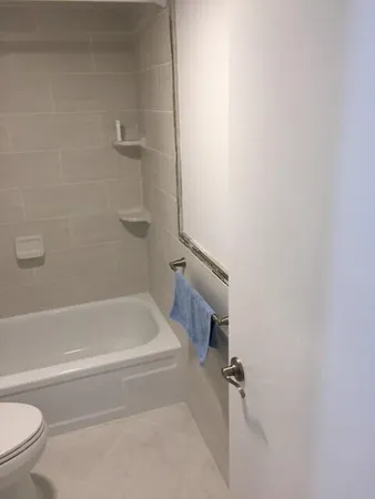 a bathroom with a shower and a toilet