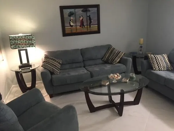 a living room with furniture and a window