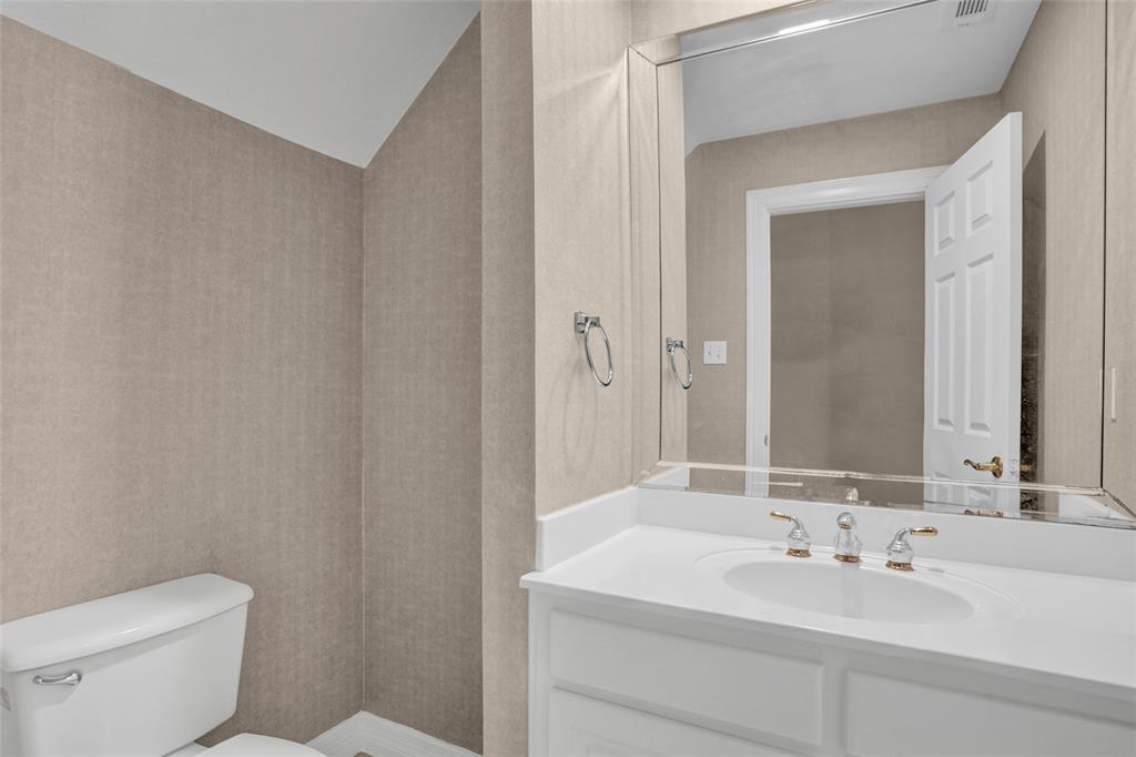 4092 Oberlin Way Addison, TX 75001 - Photo 15 of 40 Bathroom featuring toilet and vanity