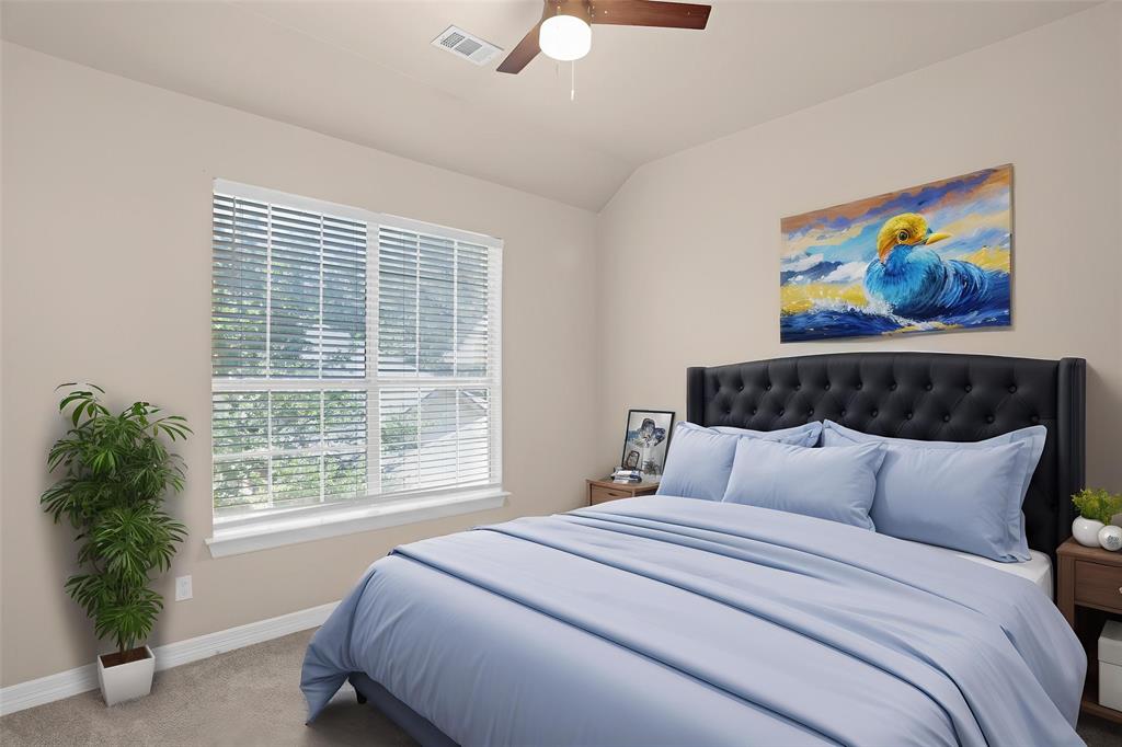 4092 Oberlin Way Addison, TX 75001 - Photo 31 of 40 Carpeted bedroom featuring baseboards, lofted ceiling, and a ceiling fan