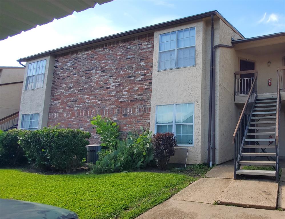 12480 Abrams Road, Unit 2925 Dallas, TX 75243 - Photo 1 of 1 a front view of a house with garden