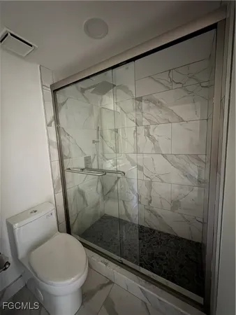 a kitchen with a stove and a refrigerator