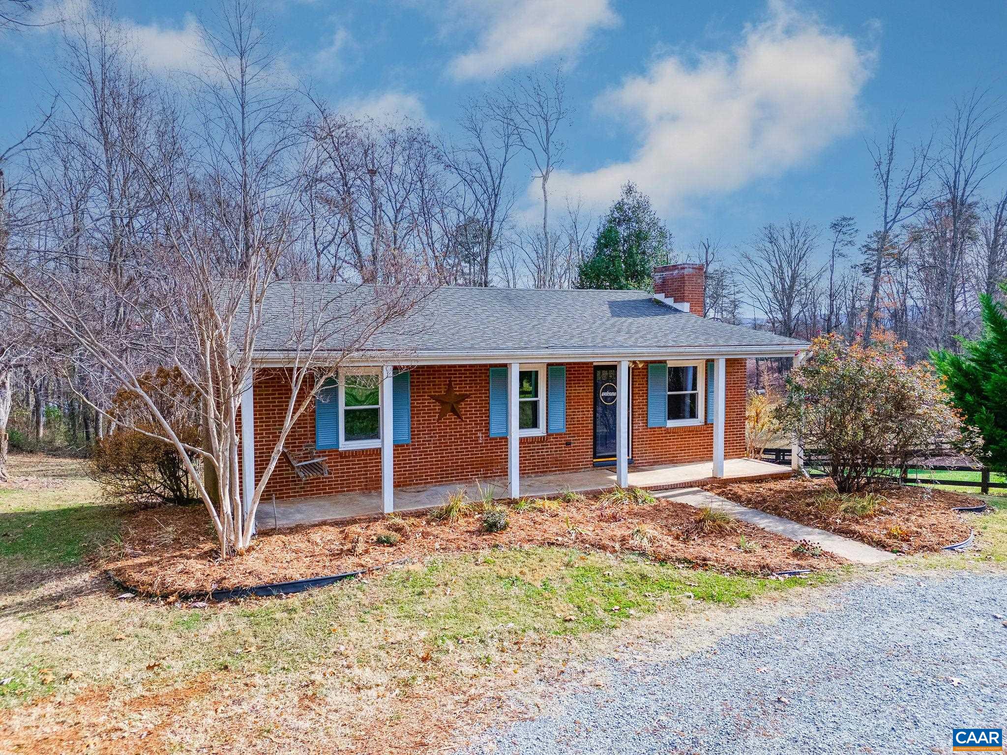 569 Half Mile Branch Road Crozet, VA 22932 - Photo 1 of 35 front view of a house with a yard