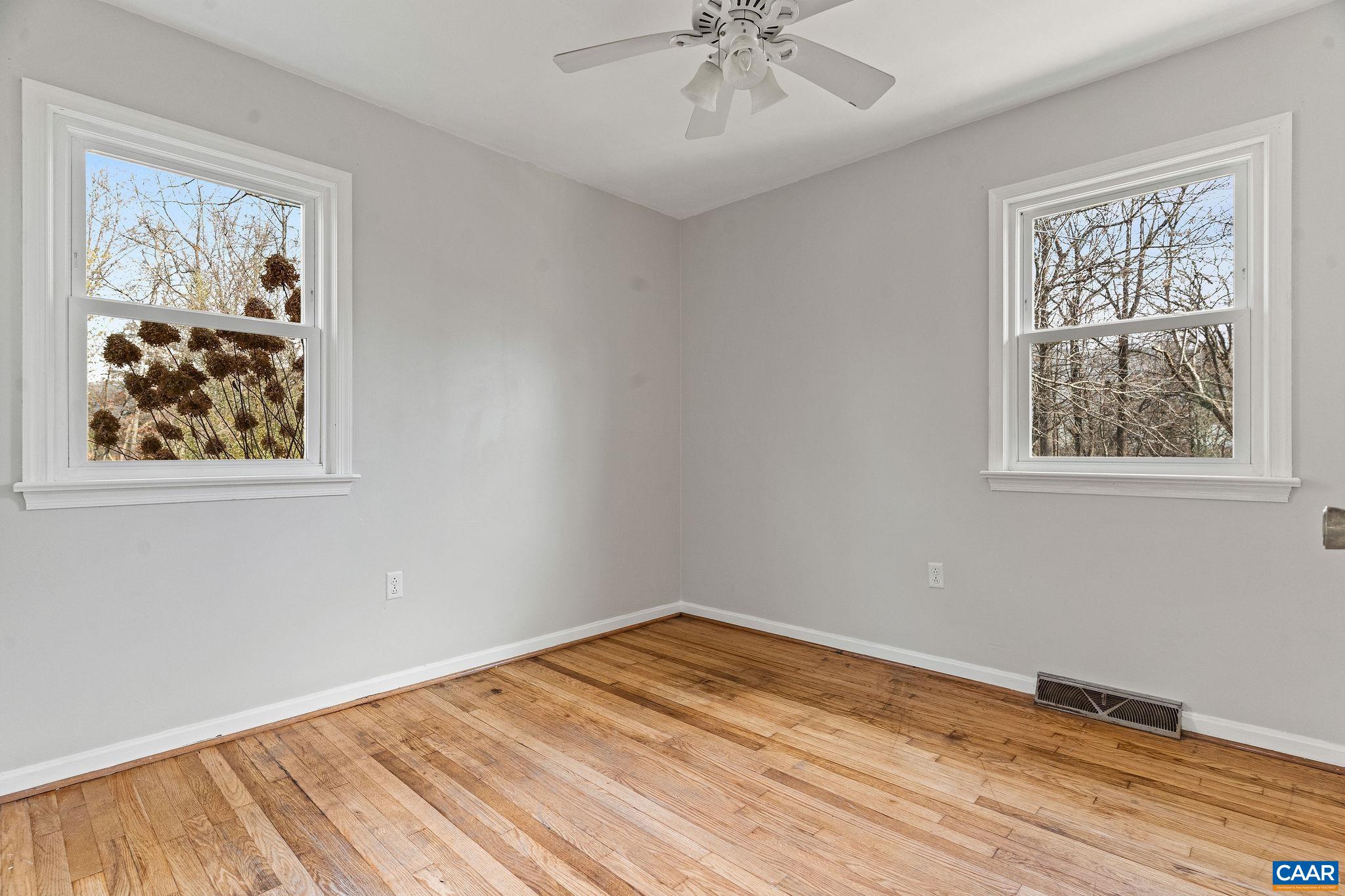 569 Half Mile Branch Road Crozet, VA 22932 - Photo 14 of 35 a view of a room with wooden floor and window