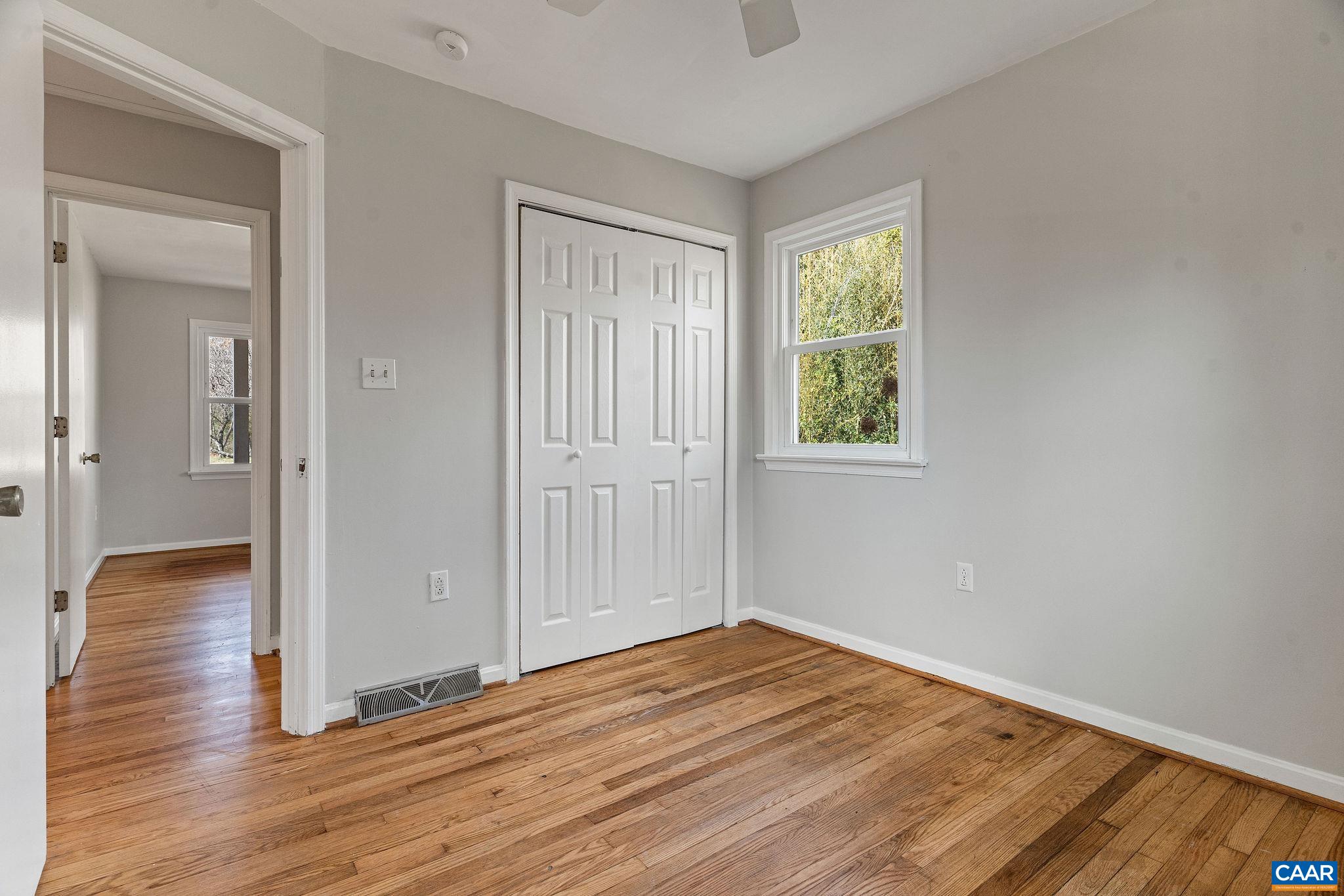 569 Half Mile Branch Road Crozet, VA 22932 - Photo 15 of 35 a view of a room with wooden floor and window