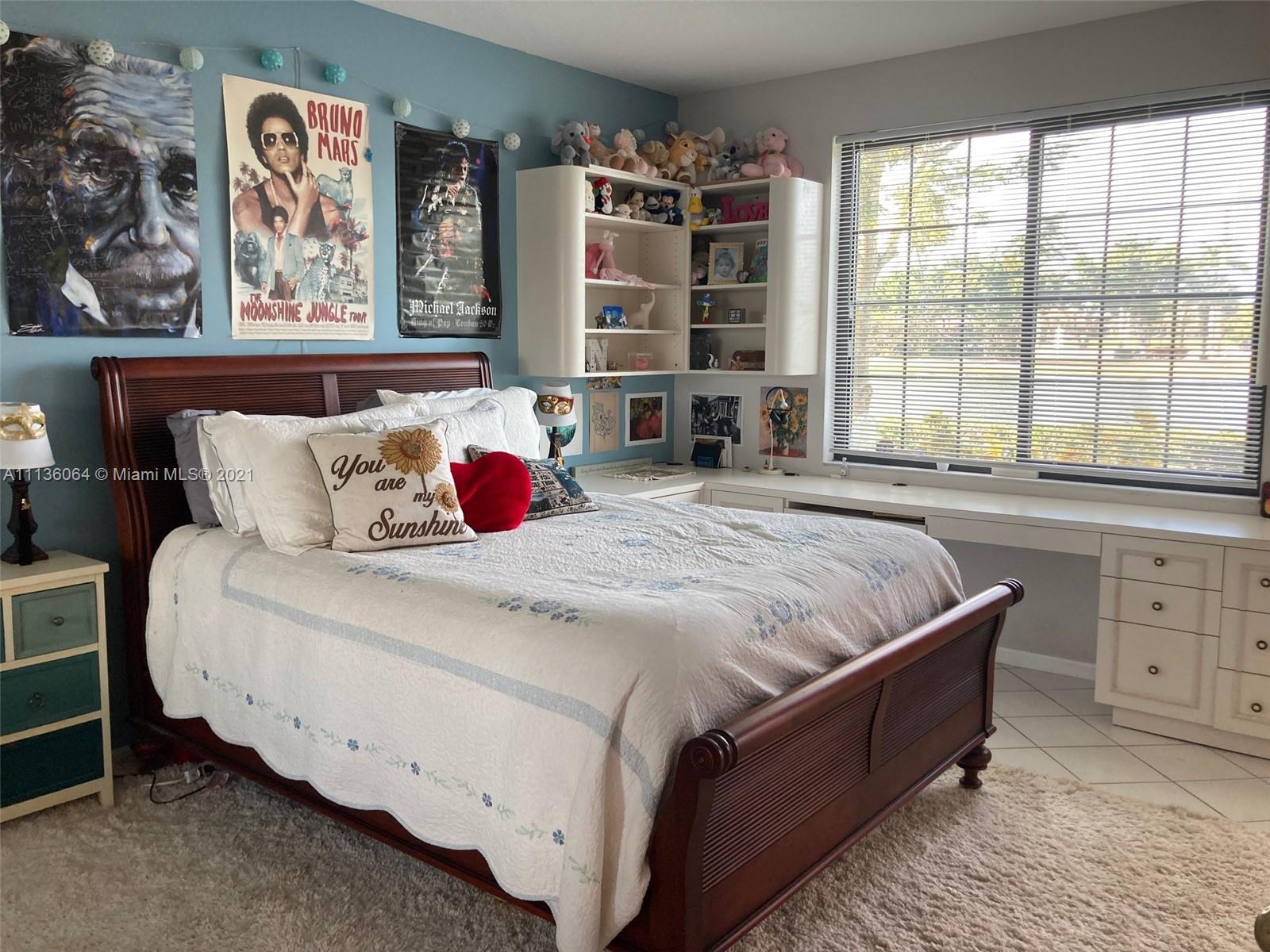 6765 Montego Bay Boulevard, Unit E Boca Raton, FL 33433 - Photo 12 of 31 a bedroom with a bed and a window