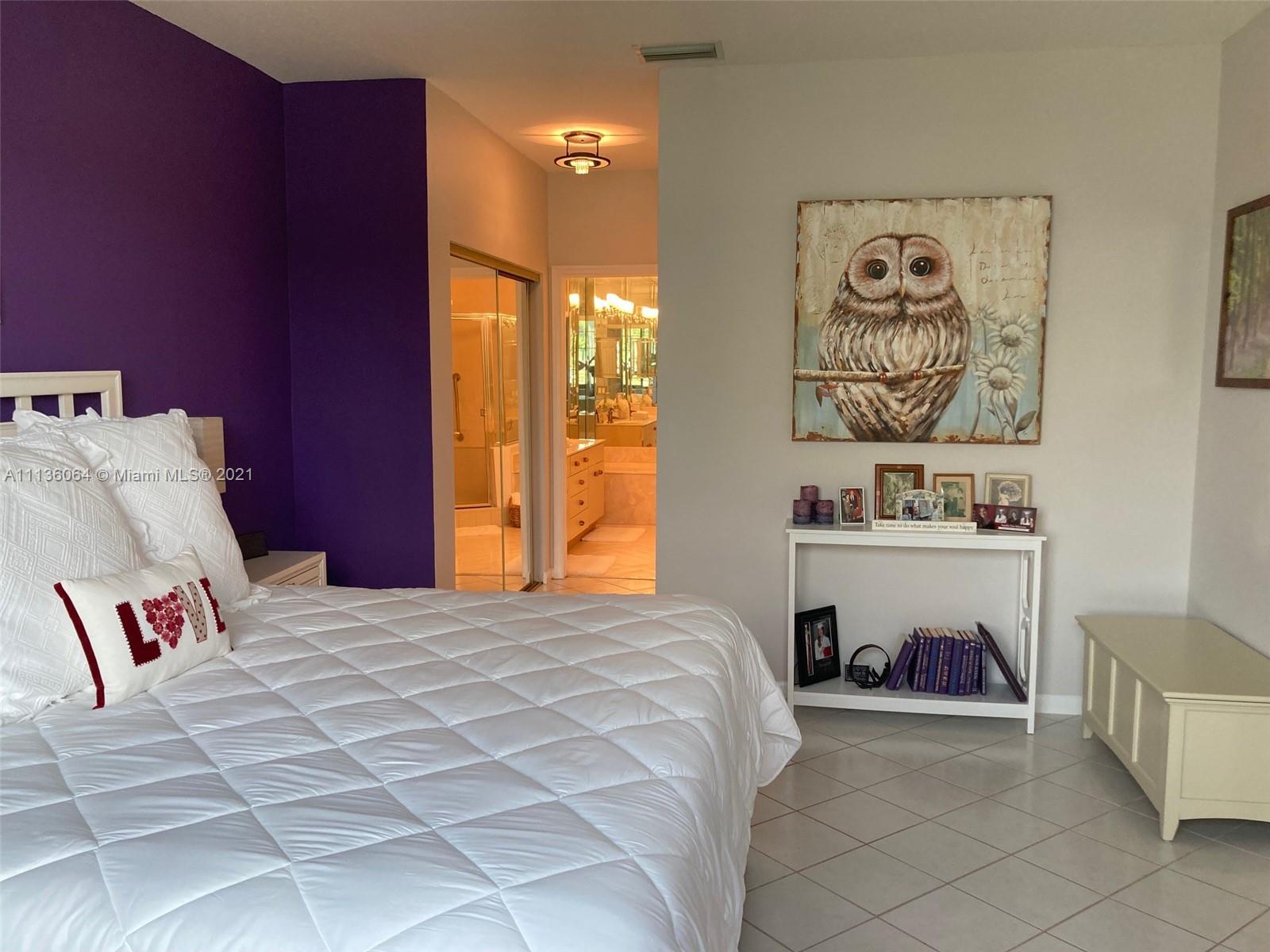 6765 Montego Bay Boulevard, Unit E Boca Raton, FL 33433 - Photo 20 of 31 a bed room with a bed and a couch