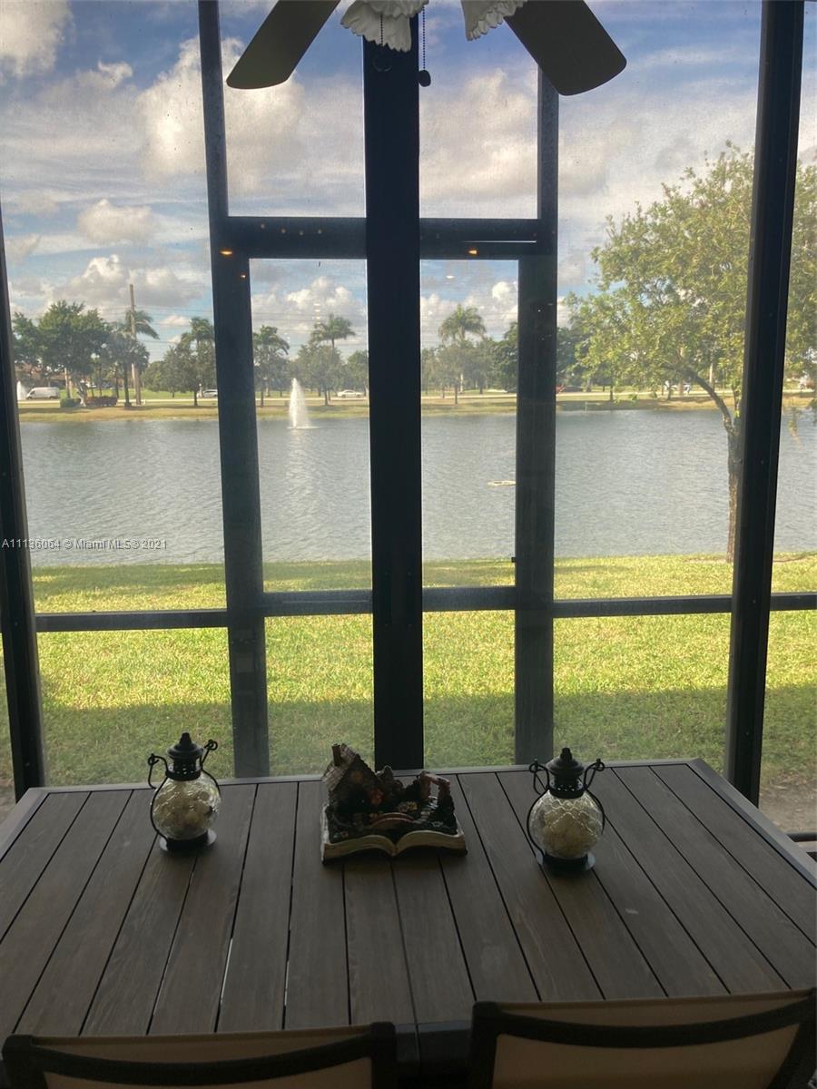 6765 Montego Bay Boulevard, Unit E Boca Raton, FL 33433 - Photo 25 of 31 a room with wooden floor and a large window