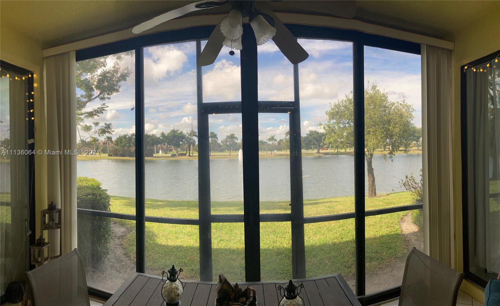 6765 Montego Bay Boulevard, Unit E Boca Raton, FL 33433 - Photo 26 of 31 a view of living room with large windows and furniture