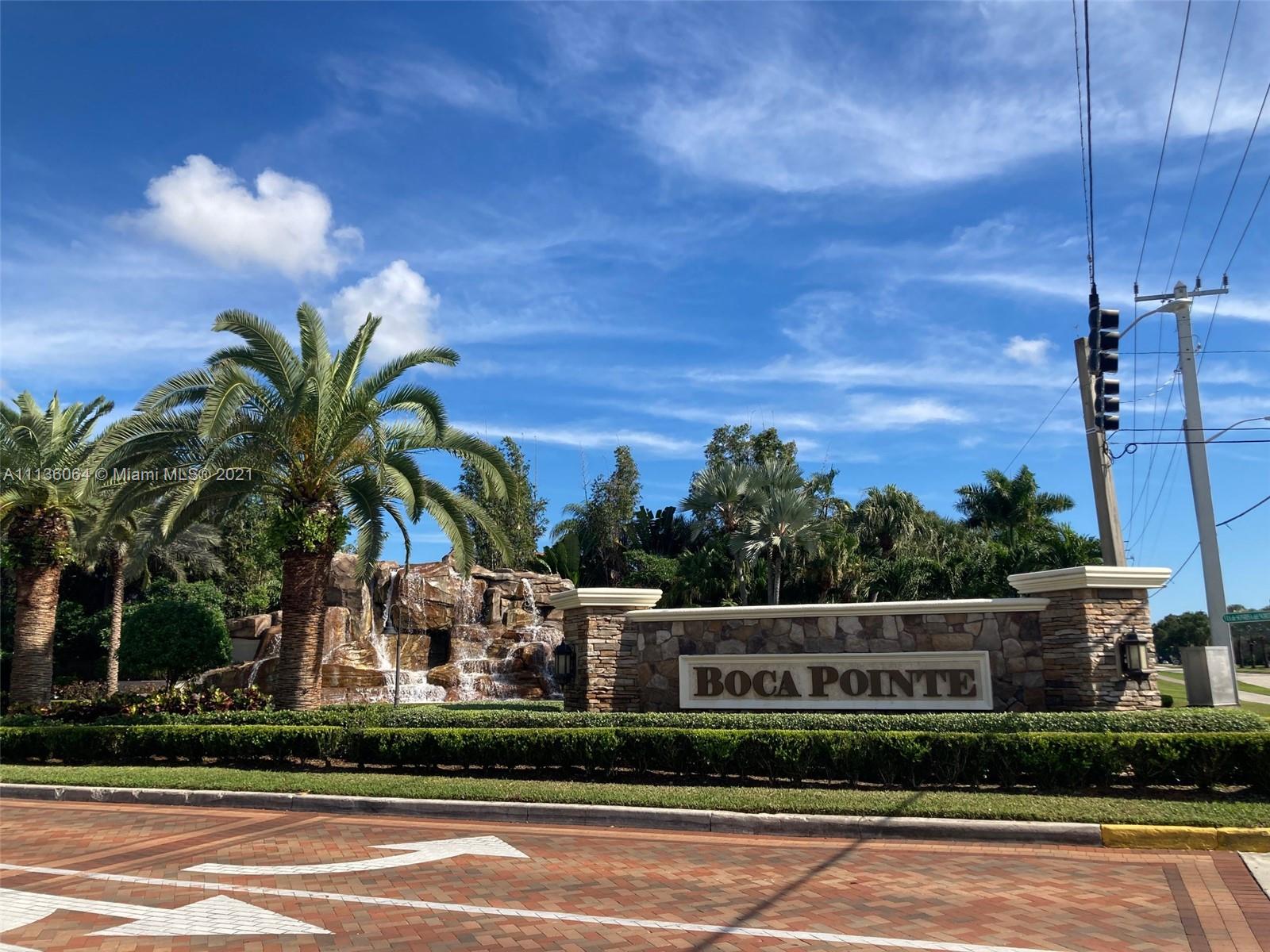6765 Montego Bay Boulevard, Unit E Boca Raton, FL 33433 - Photo 29 of 31 a view of a house with a street