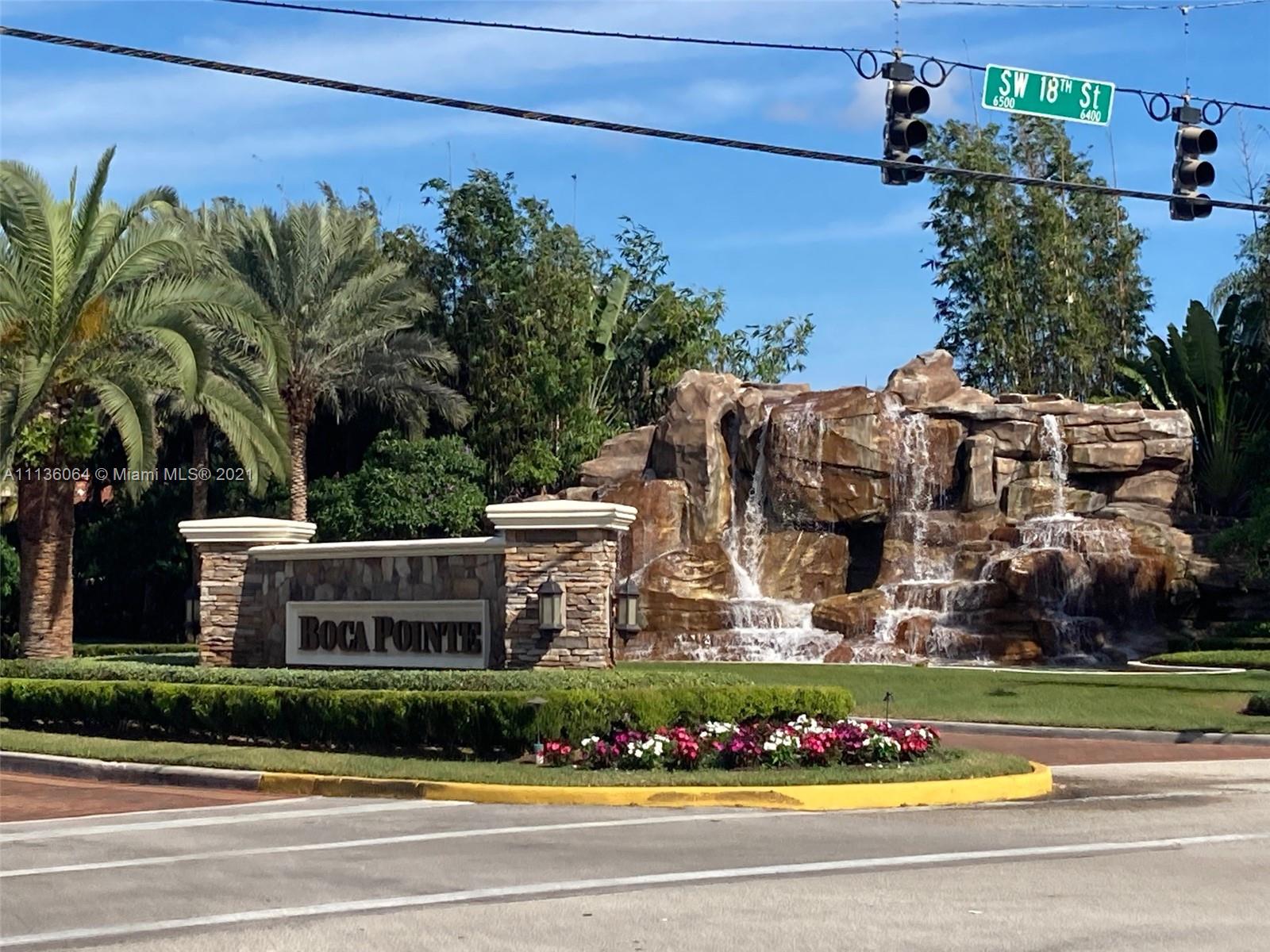 6765 Montego Bay Boulevard, Unit E Boca Raton, FL 33433 - Photo 30 of 31 front view of a house with a garden