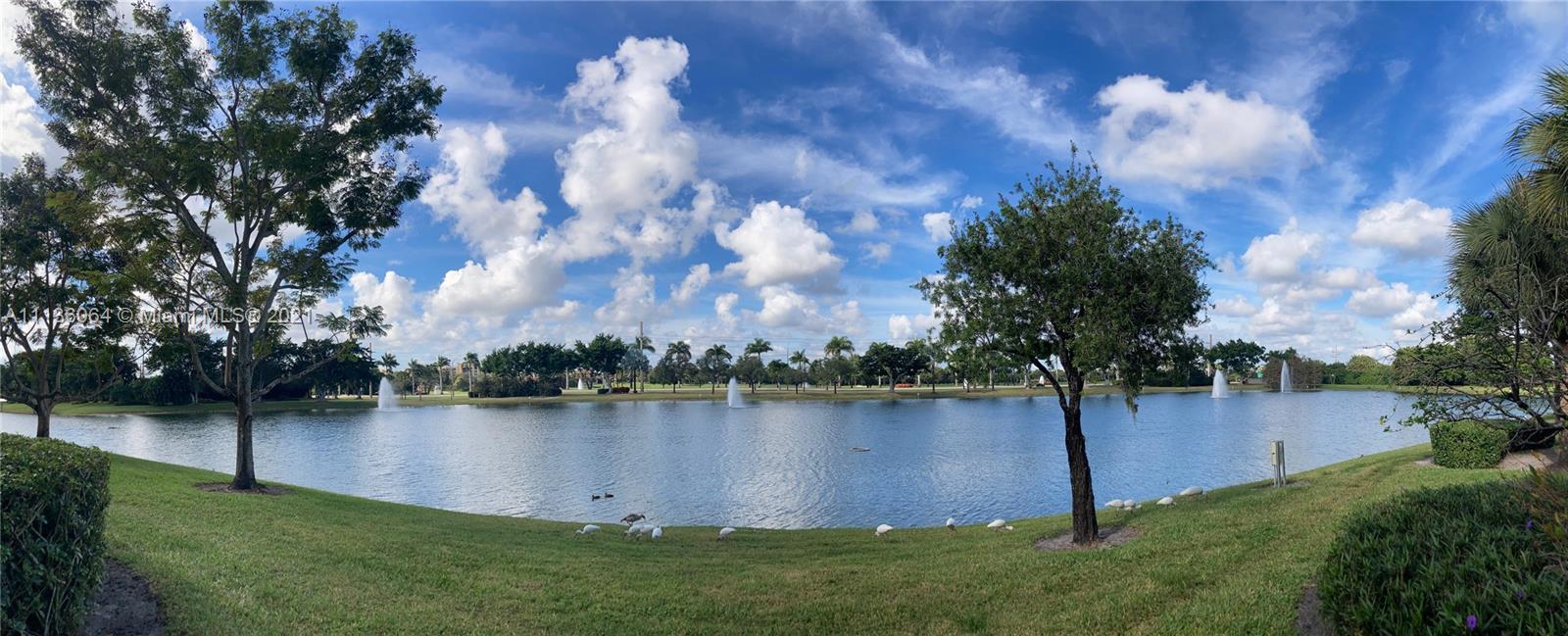 6765 Montego Bay Boulevard, Unit E Boca Raton, FL 33433 - Photo 5 of 31 a view of a lake with houses in back