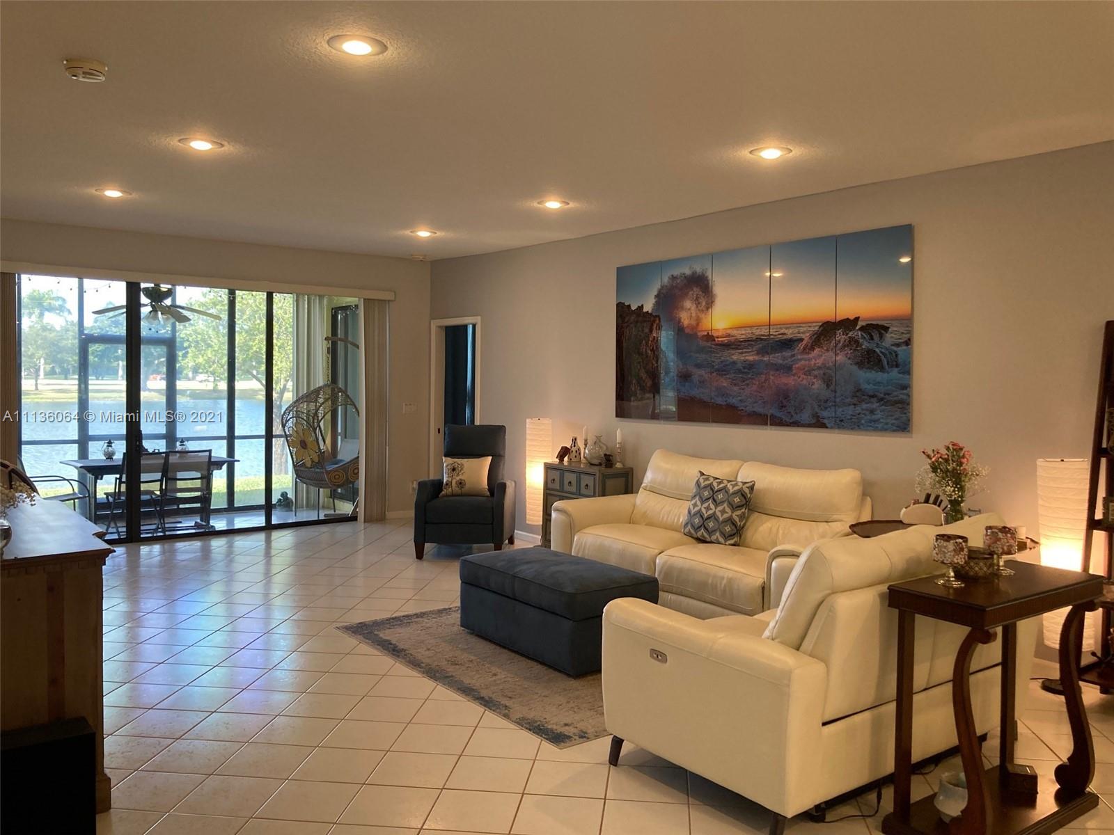 6765 Montego Bay Boulevard, Unit E Boca Raton, FL 33433 - Photo 10 of 31 a living room with furniture and large pool table with wooden floor