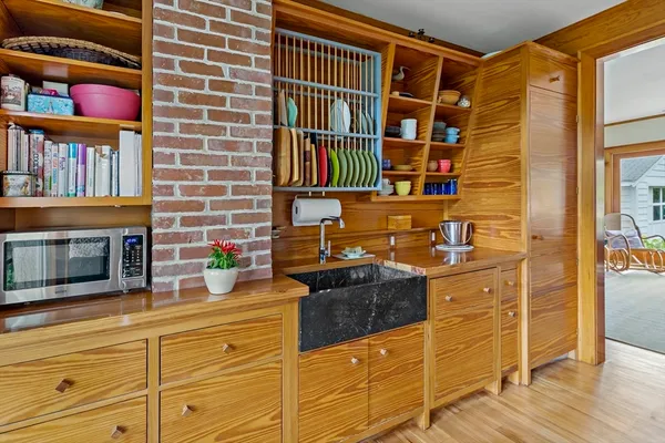 a kitchen with stainless steel appliances granite countertop a stove and a cabinets