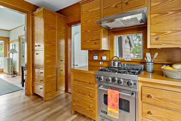 a kitchen with stainless steel appliances granite countertop a stove and a refrigerator