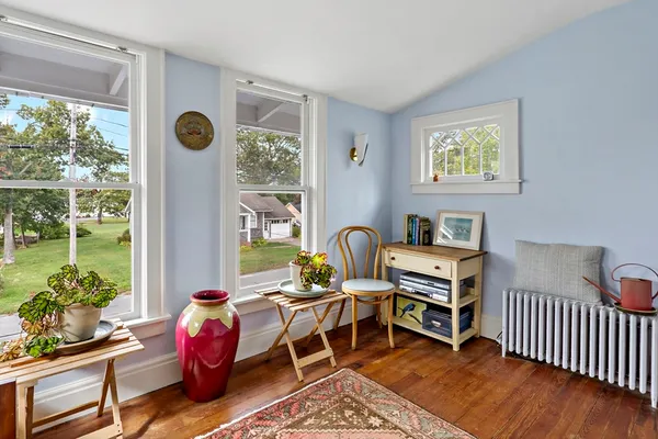 a bedroom with furniture and a window