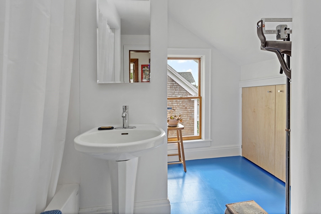 34 Washington Bourne, MA 02532 - Photo 21 of 34 a bathroom with a sink a mirror and wooden floor