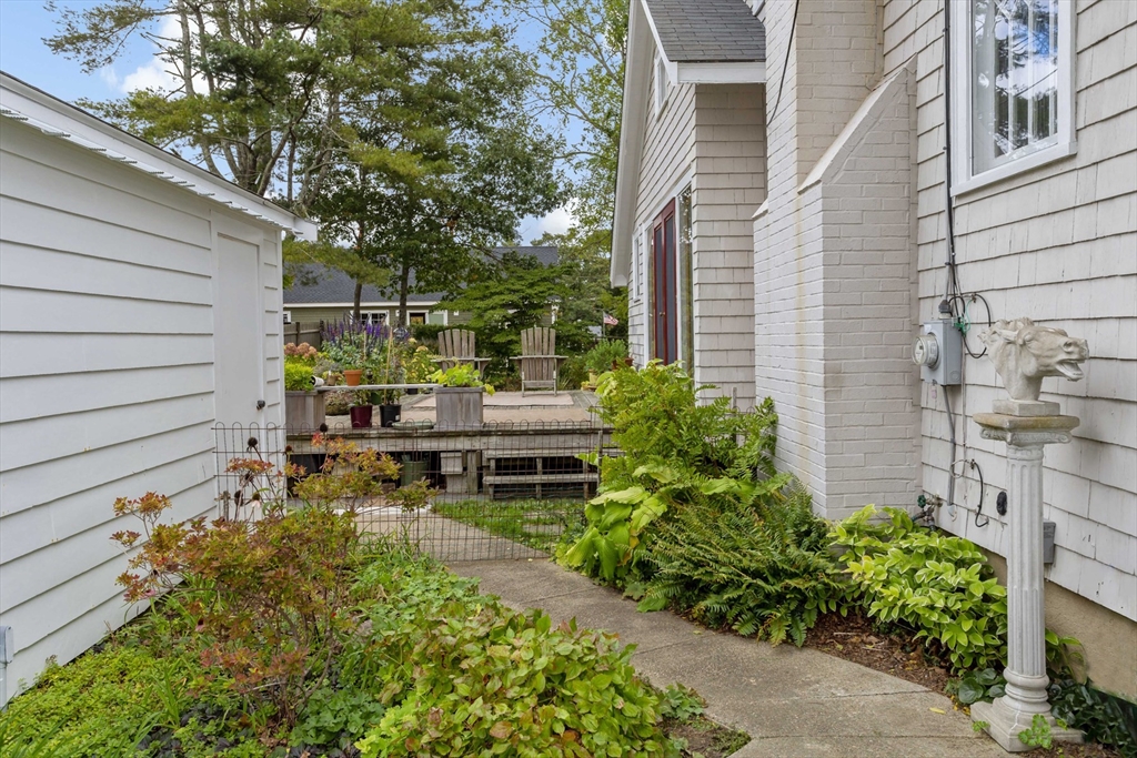 34 Washington Bourne, MA 02532 - Photo 25 of 34 a backyard of a house with outdoor seating
