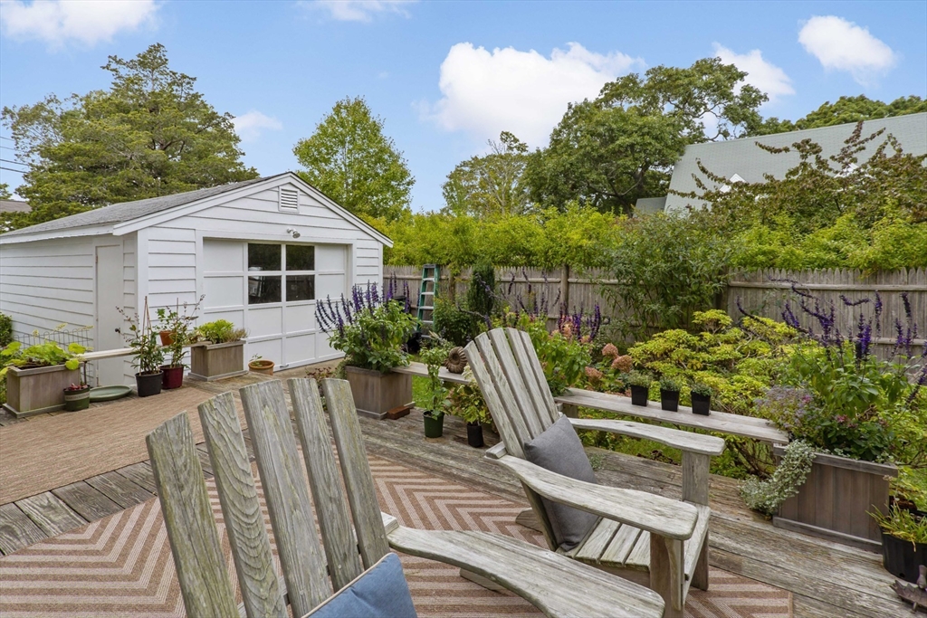 34 Washington Bourne, MA 02532 - Photo 28 of 34 a view of a chair and tables in the backyard
