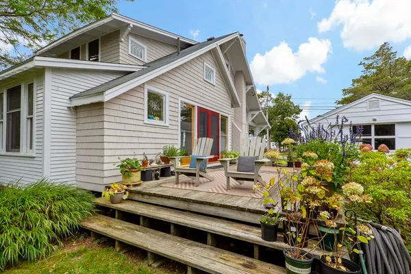 a green field with lots of trees