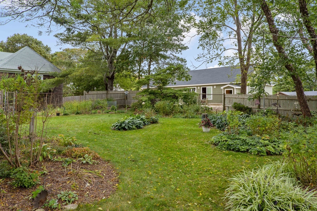 34 Washington Bourne, MA 02532 - Photo 32 of 34 a view of backyard of house with green space