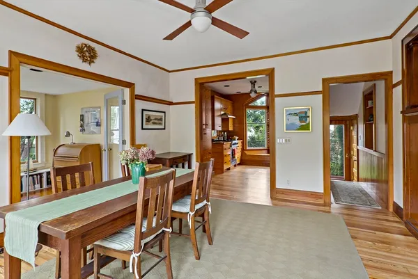 a dining room with furniture and window