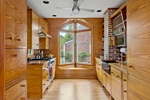 a view of a bathroom with a tub and windows