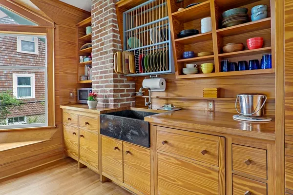 a kitchen with cabinets and window