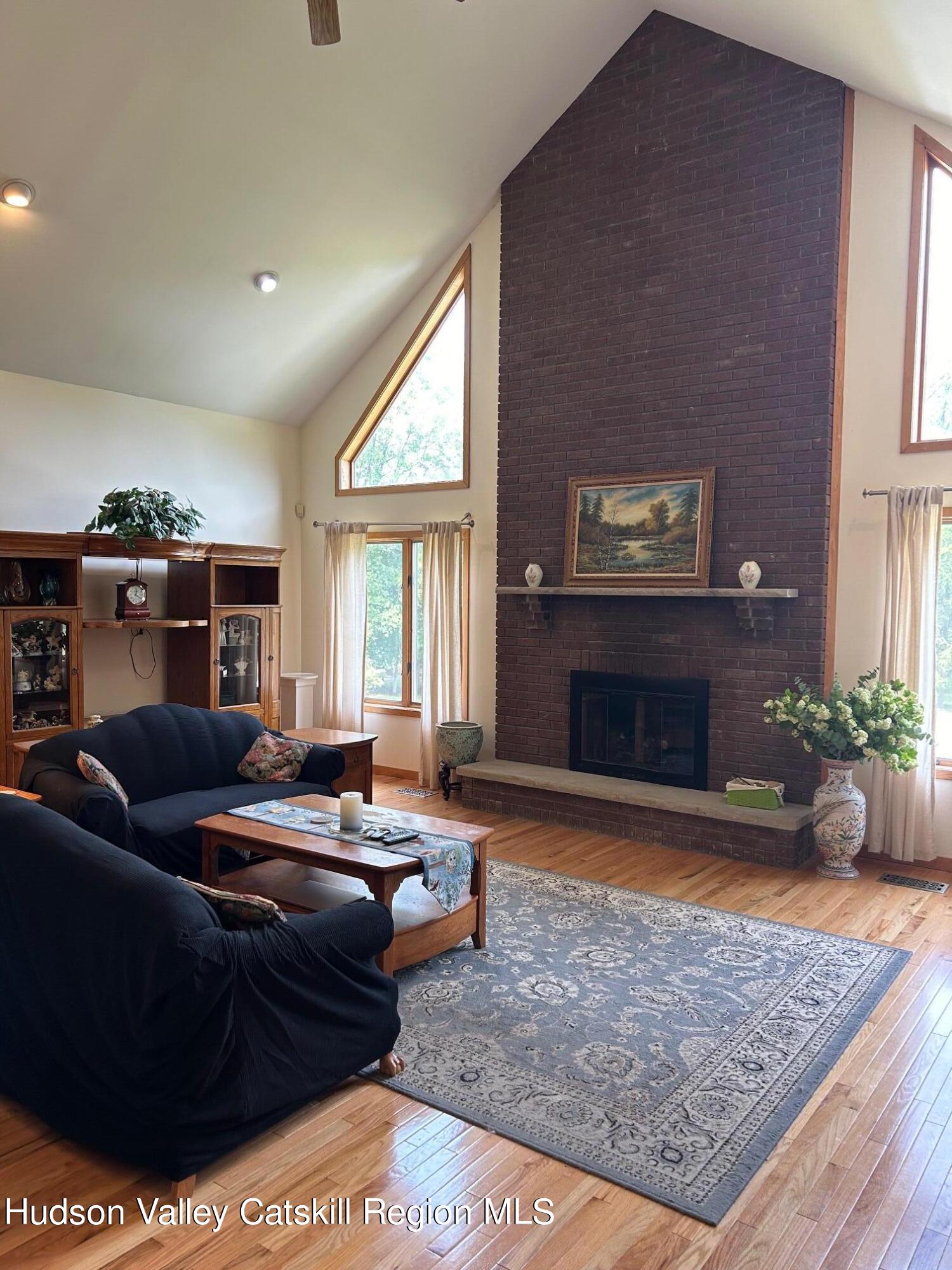 40 Tillson Lake Road Wallkill, NY 12589 - Photo 15 of 42 a living room with furniture and a fireplace