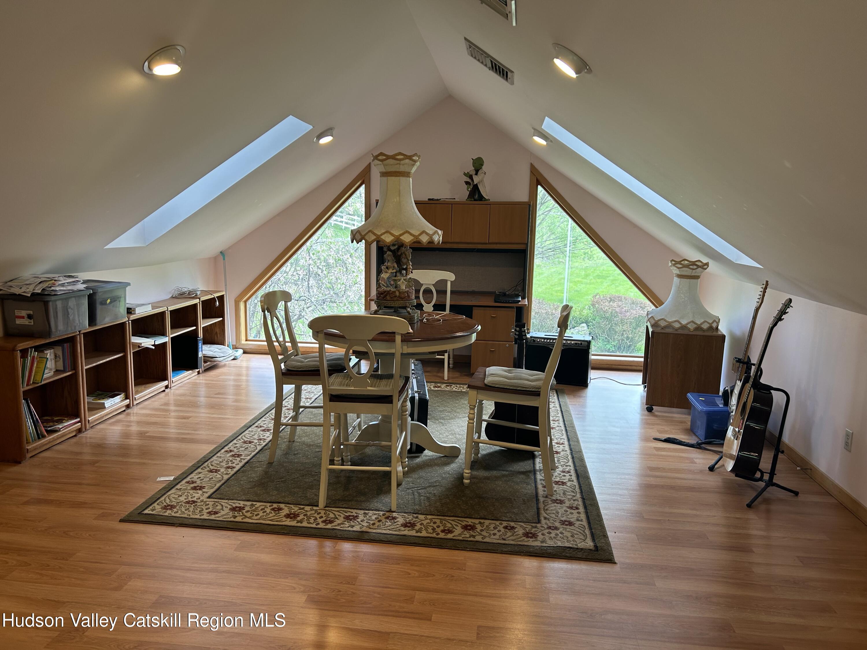 40 Tillson Lake Road Wallkill, NY 12589 - Photo 19 of 42 a dining room with furniture a rug and wooden floor