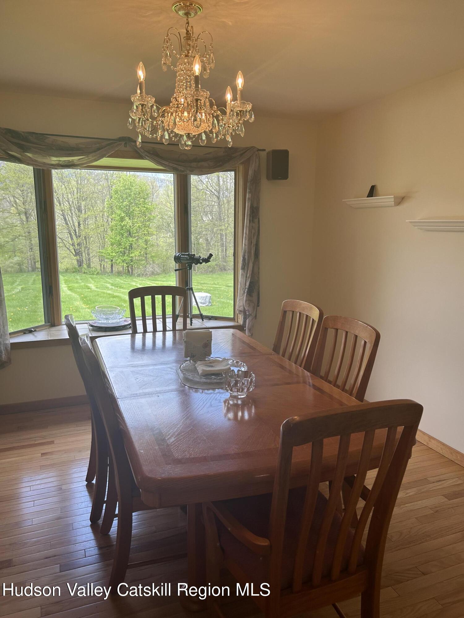 40 Tillson Lake Road Wallkill, NY 12589 - Photo 21 of 42 a view of a dining room with furniture window and outside view