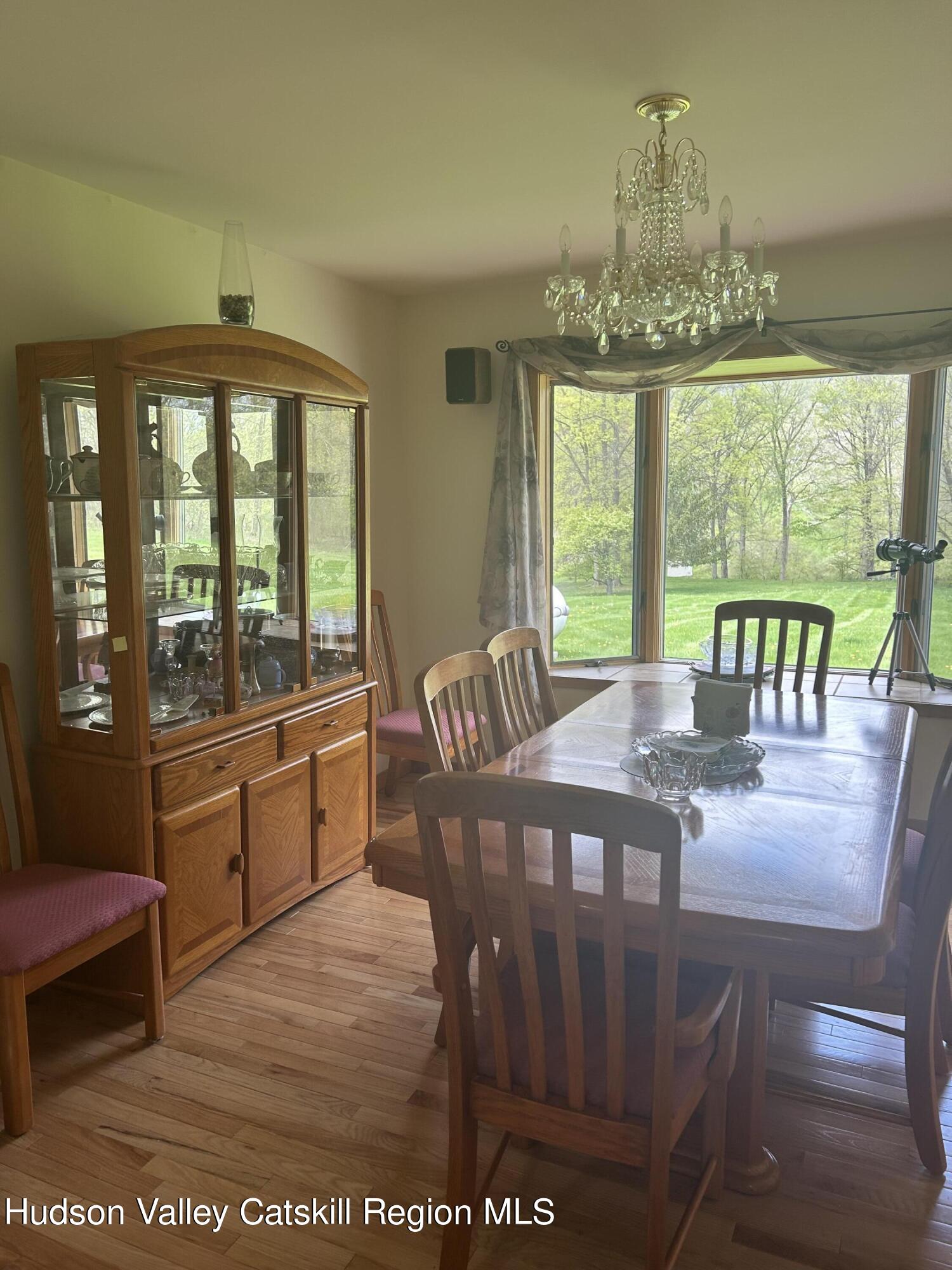 40 Tillson Lake Road Wallkill, NY 12589 - Photo 22 of 42 a view of a dining room with furniture window and outside view