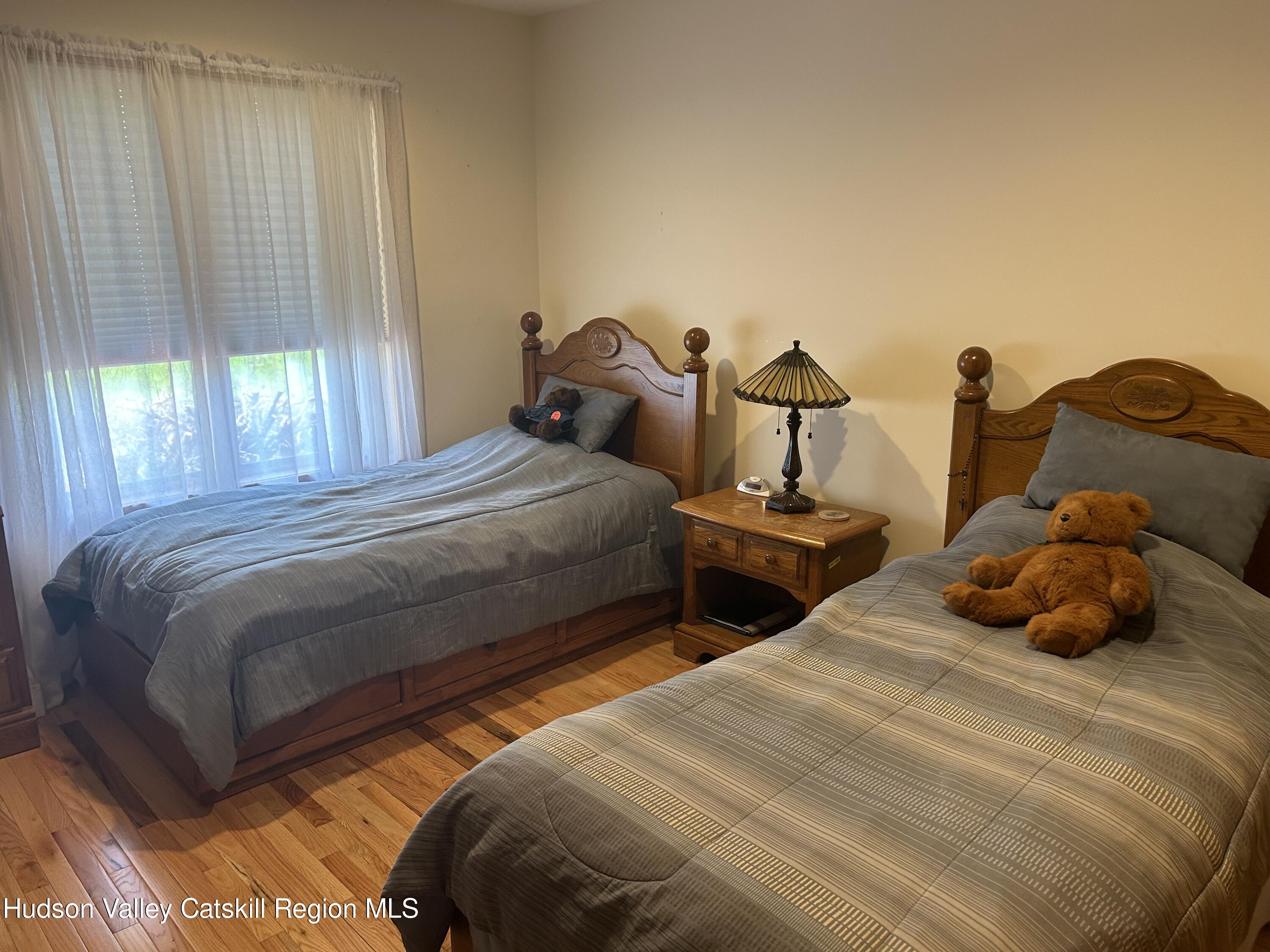 40 Tillson Lake Road Wallkill, NY 12589 - Photo 29 of 42 a bedroom with two beds and a window