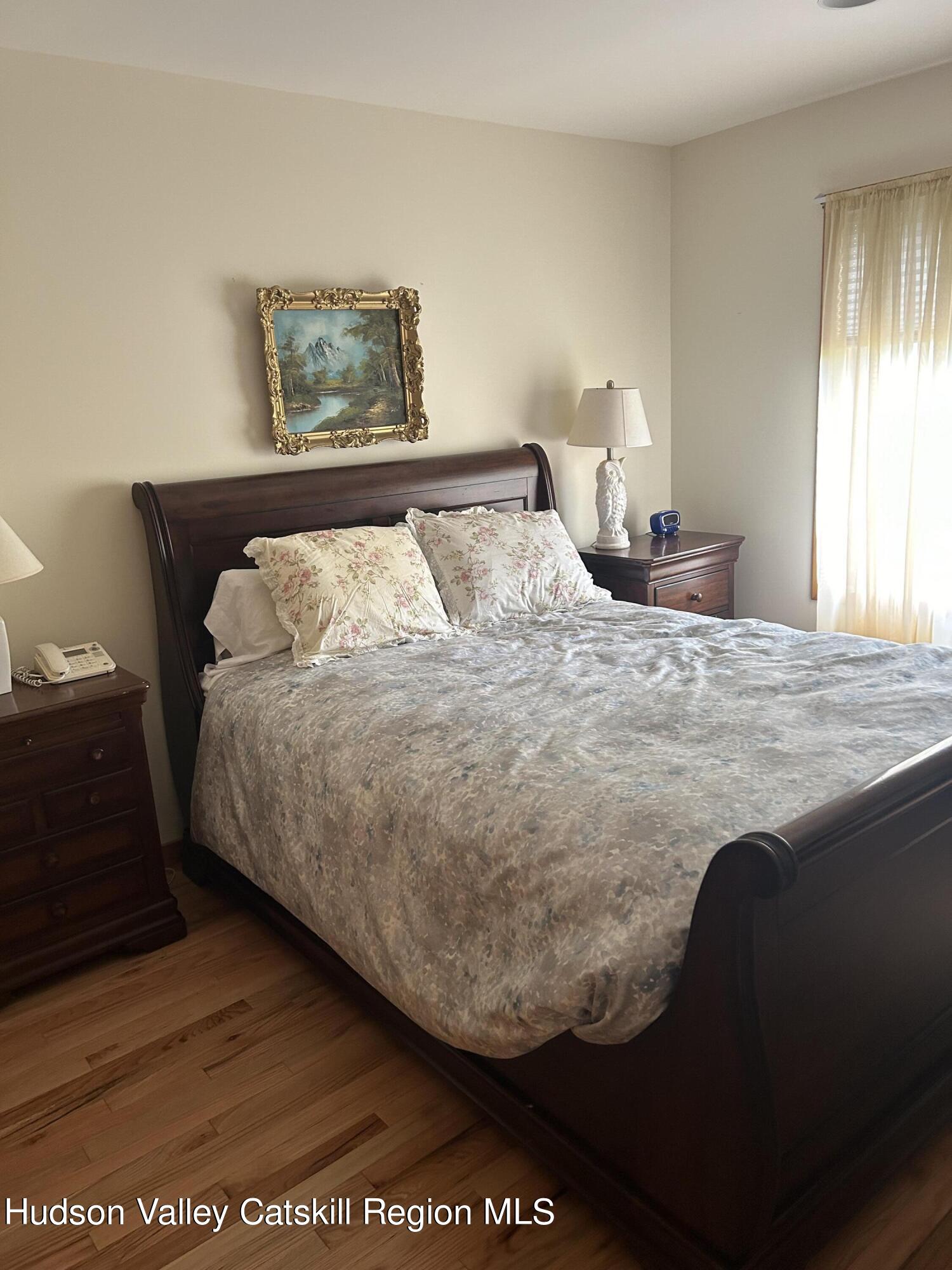 40 Tillson Lake Road Wallkill, NY 12589 - Photo 33 of 42 a bed sitting in a bedroom next to a window