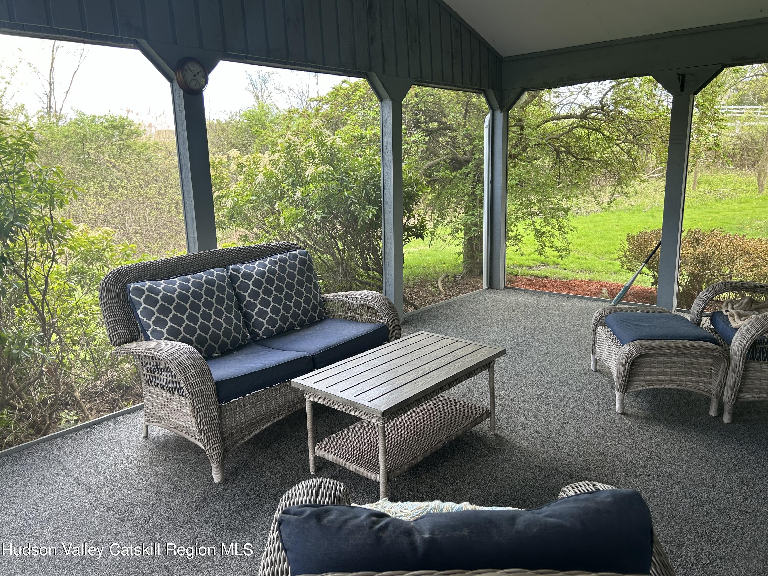 40 Tillson Lake Road Wallkill, NY 12589 - Photo 34 of 42 a living room with furniture and a floor to ceiling window