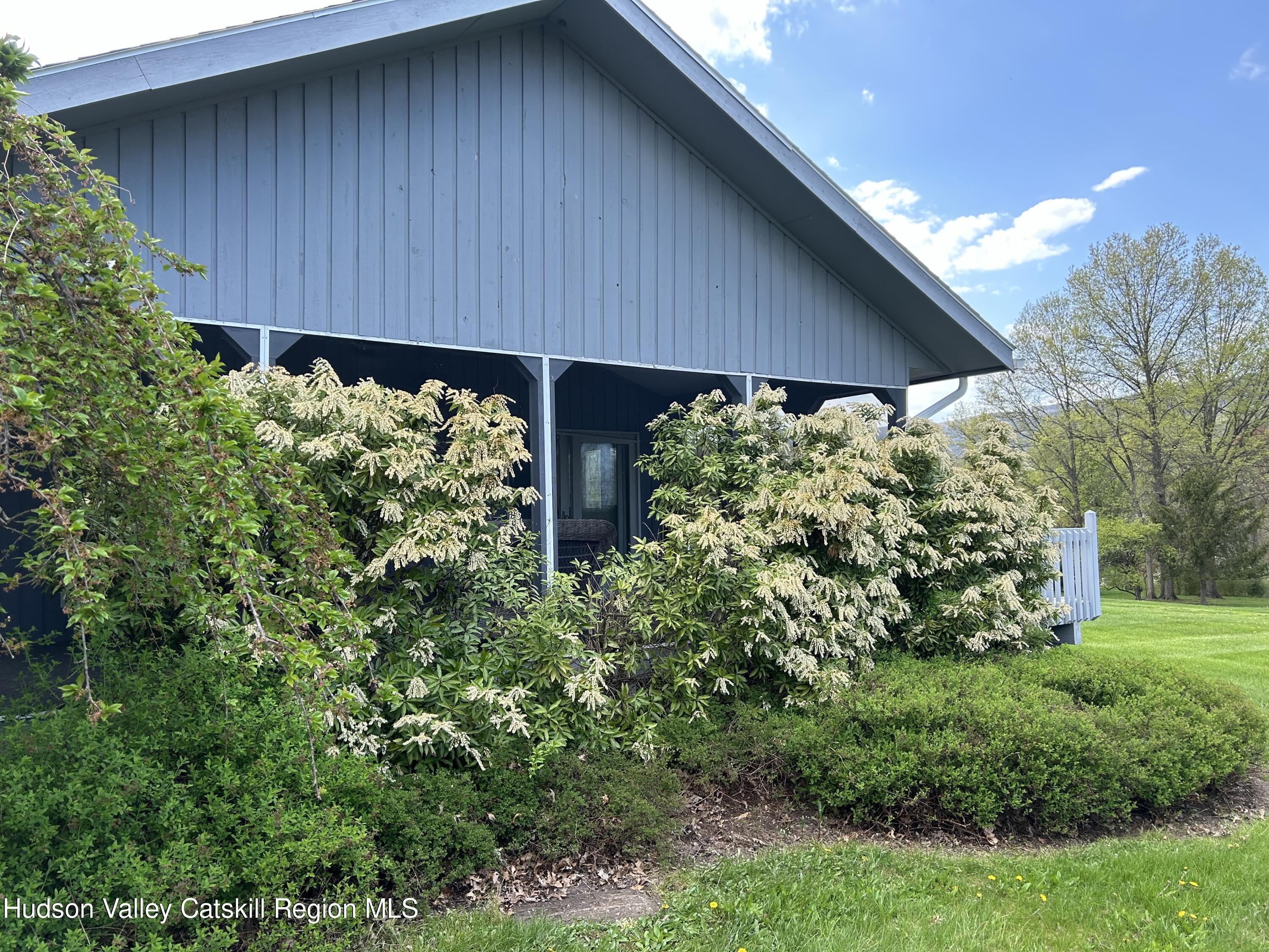 40 Tillson Lake Road Wallkill, NY 12589 - Photo 6 of 42 a view of a backyard with potted plants