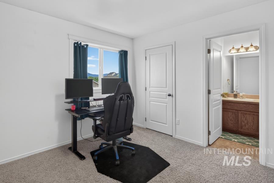 1337 Bristol Road Moscow, ID 83843 - Photo 20 of 28 Carpeted room with a window, white walls, and a two-panel interior door