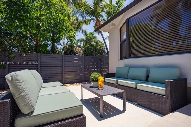 a view of outdoor sitting area with furniture