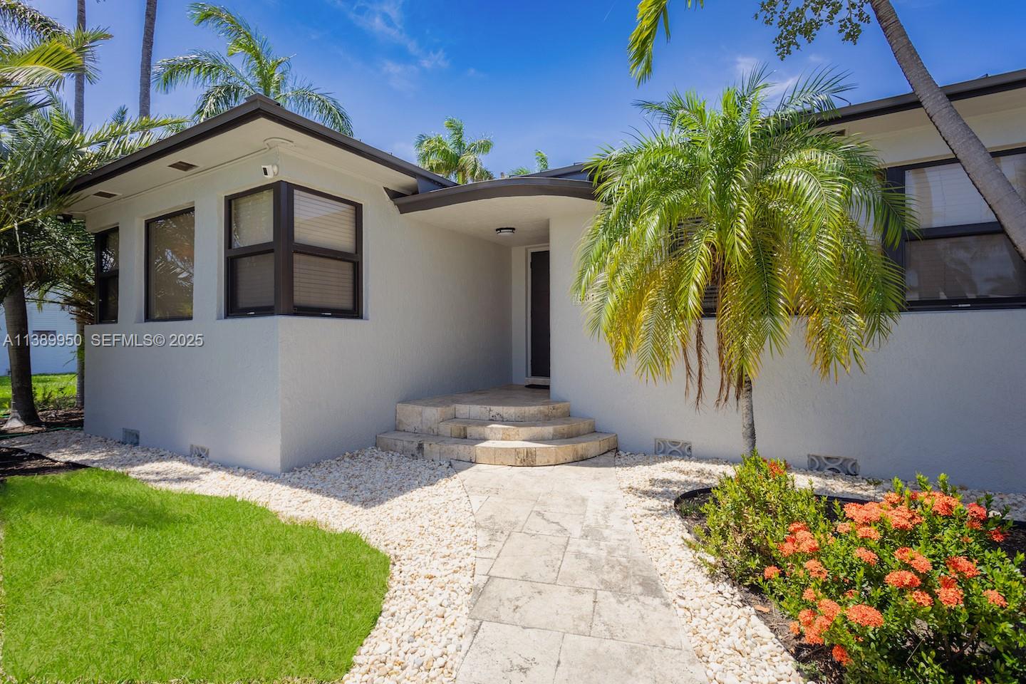 801 Harrison Street Hollywood, FL 33019 - Photo 12 of 46 a front view of a house with a yard