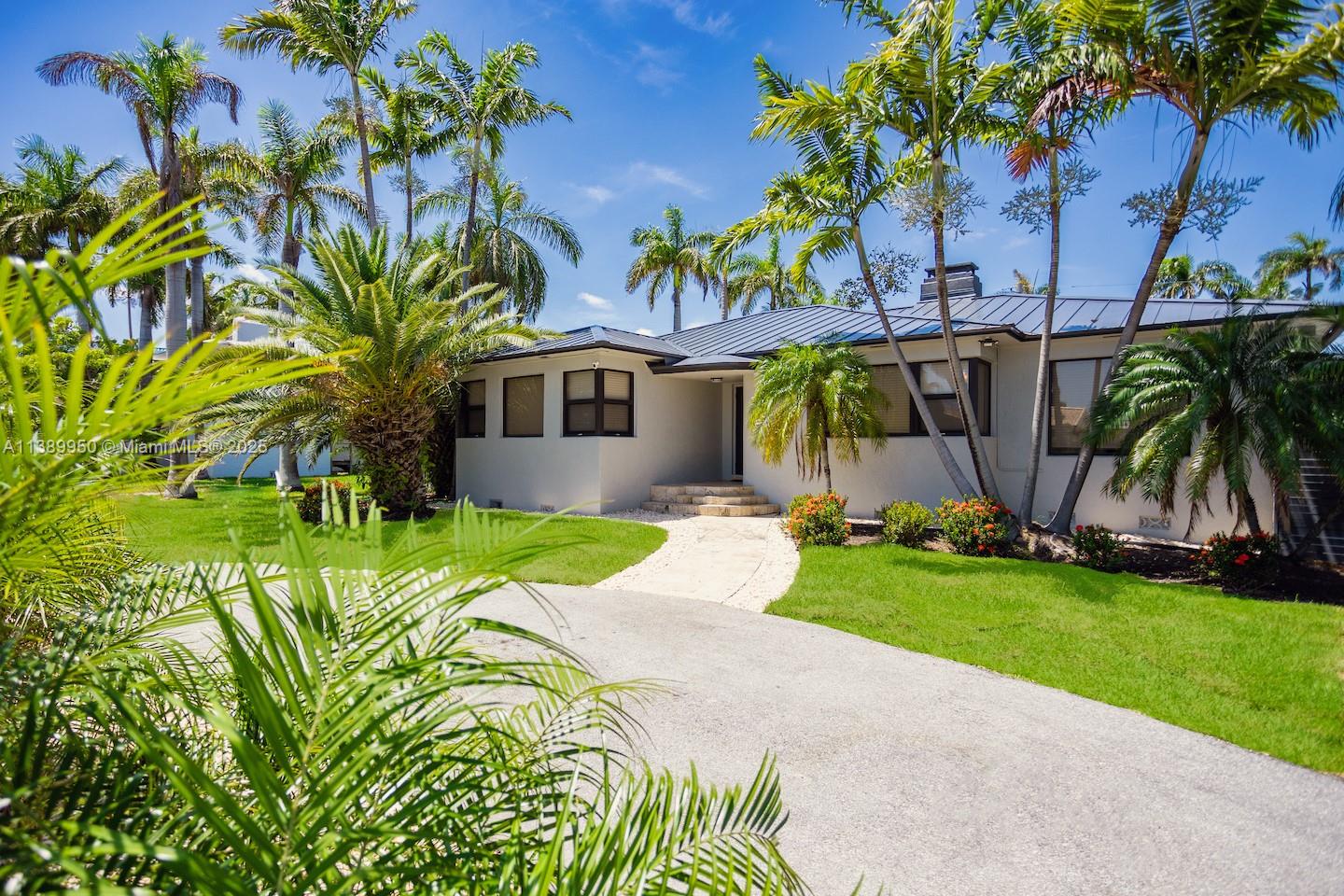 801 Harrison Street Hollywood, FL 33019 - Photo 14 of 46 a front view of a house with garden