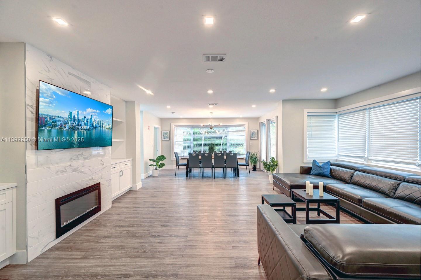 801 Harrison Street Hollywood, FL 33019 - Photo 16 of 46 a living room with fireplace furniture and a flat screen tv