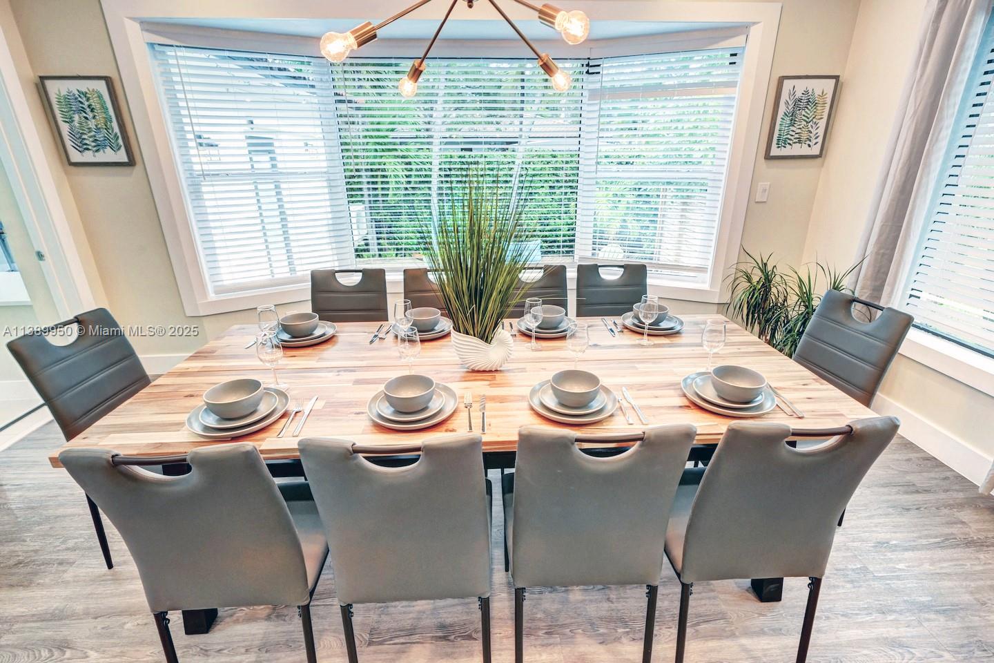 801 Harrison Street Hollywood, FL 33019 - Photo 19 of 46 a view of a dining room that has a table and chairs