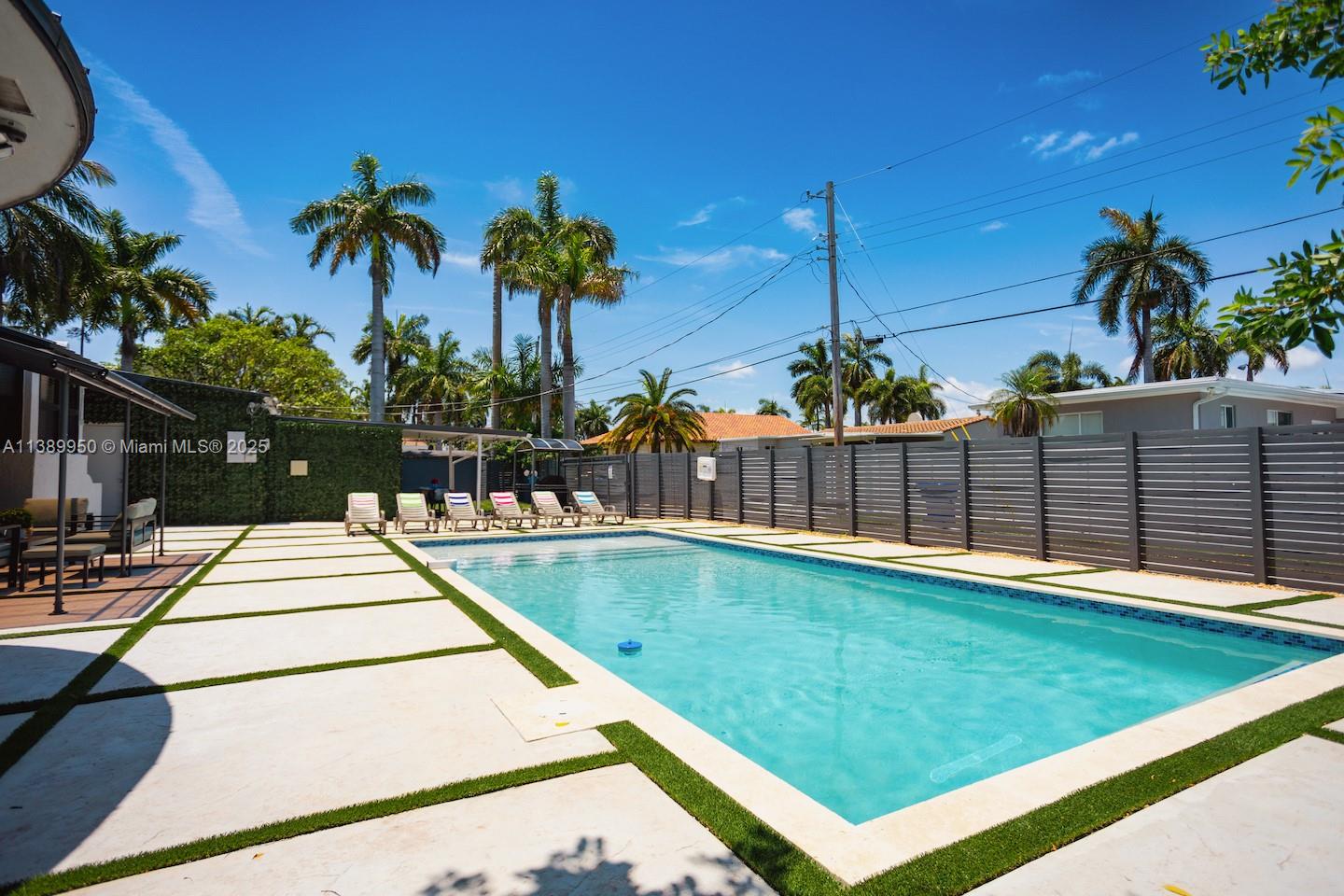 801 Harrison Street Hollywood, FL 33019 - Photo 2 of 46 a view of a backyard and basketball court
