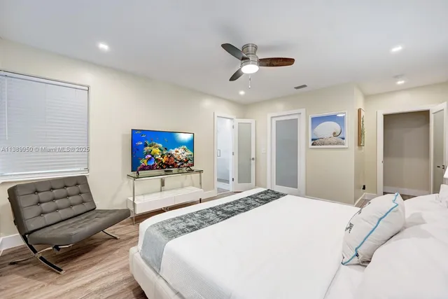 a bedroom with a bed and a chair